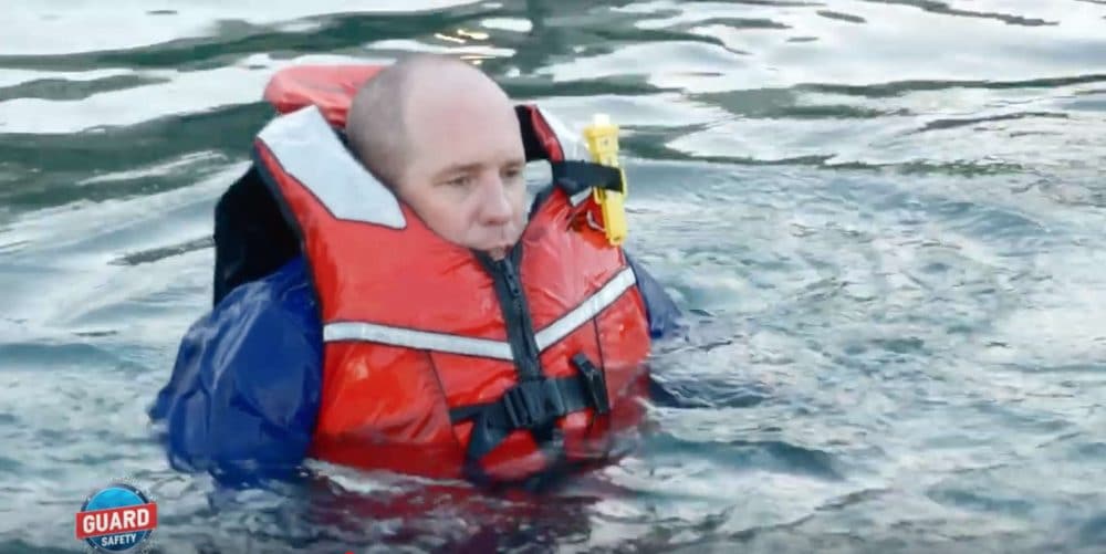 man in badly adjusted life jacket